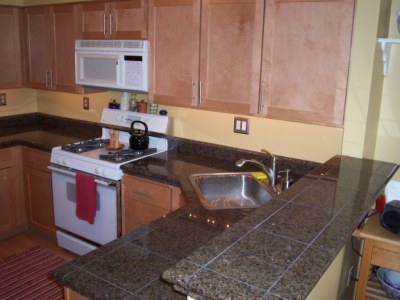 Kitchen with granite tile counter