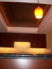 Stamped copper ceiling above bar